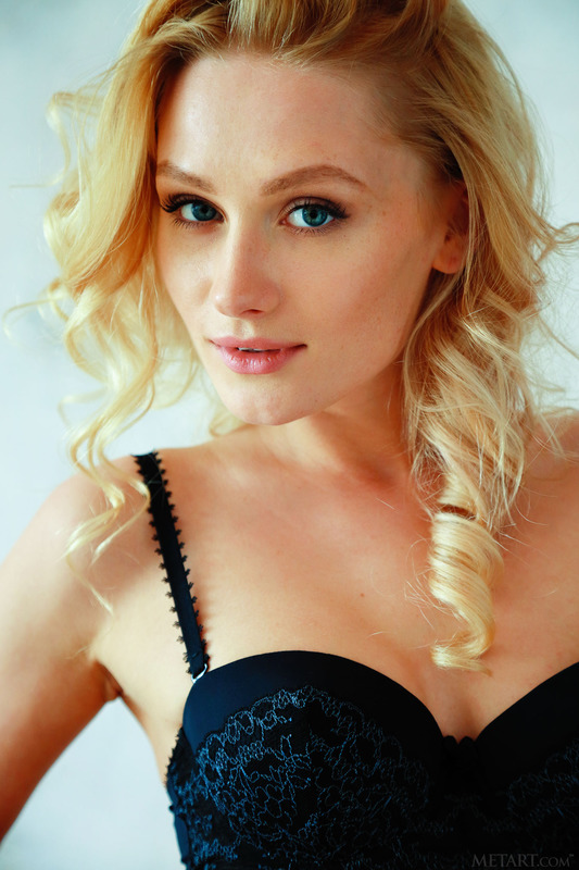 Gerda slips the strap from her bra 8