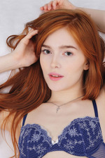 Porcelain pale beauty Jia Lissa lies on her bed in sexy blue lingerie 00